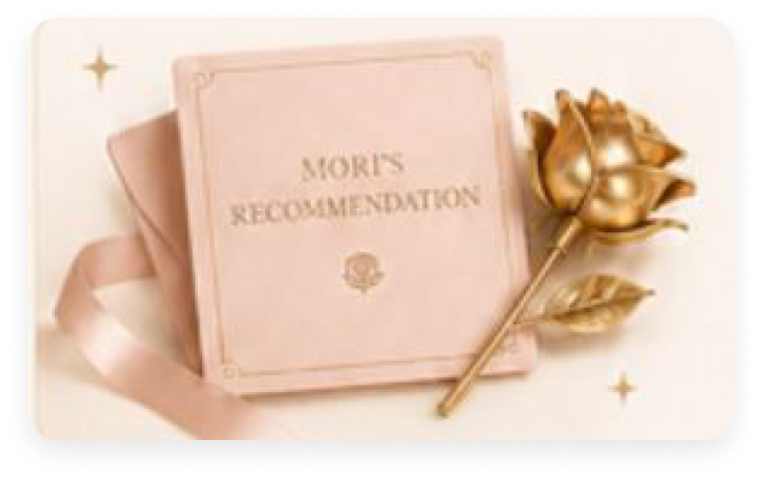 Pink velvet ELDREVE gift box beside a gold-dipped rose